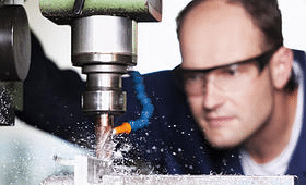 https://www.bigstockphoto.com/image-20758328/stock-photo-close-up-of-worker-with-safety-glasses-at-milling-machine-in-workshop