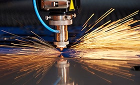 laser cutter on metal creating massive sparks